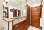 The guest bathroom features a washer and dryer